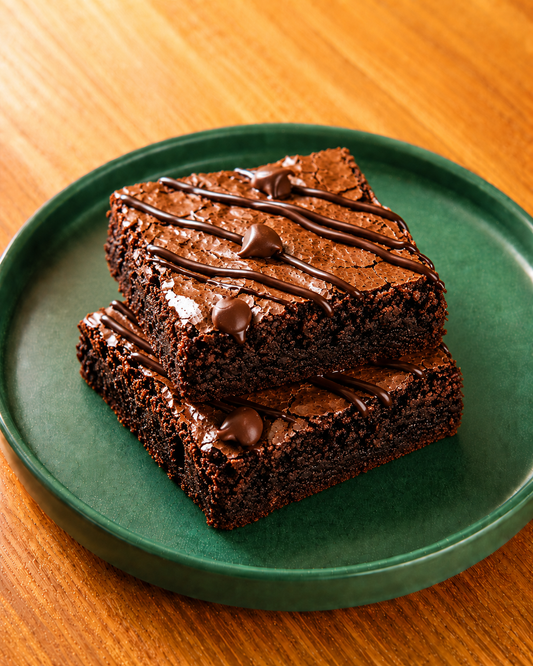 Caby & Byke chocolate brownie with chocolate drizzle on green plate