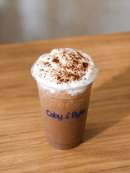 Refreshing iced Mocha Frappe topped with whipped cream at Caby & Byke.