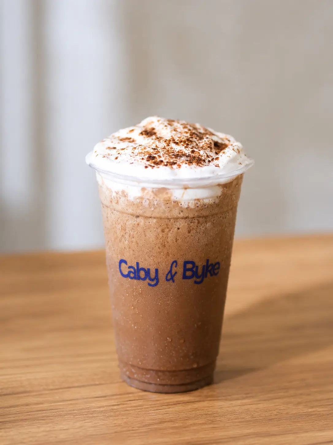 Creamy Mocha Frappe with whipped cream and chocolate topping at Caby & Byke.